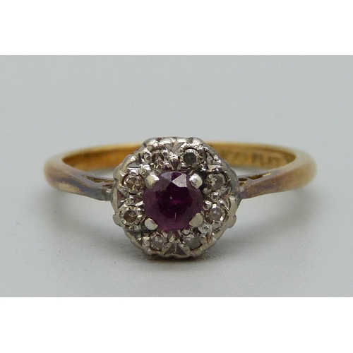 1054 - An 18ct gold, platinum, ruby and diamond cluster ring, 3.1g, N