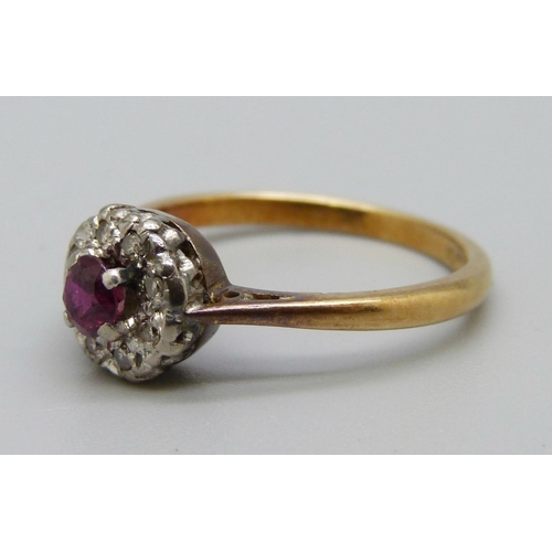 1054 - An 18ct gold, platinum, ruby and diamond cluster ring, 3.1g, N