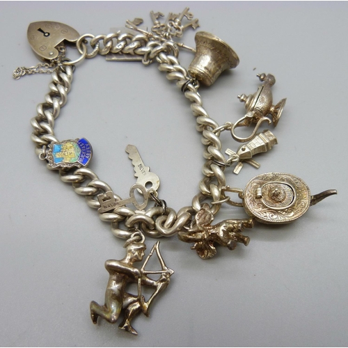 1079 - A silver charm bracelet, 68g