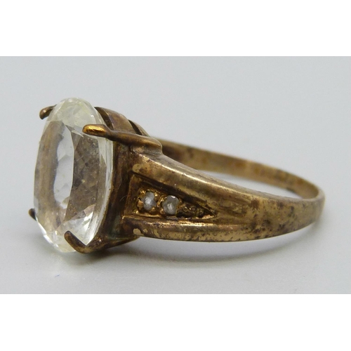 1090 - A 9ct gold ring set with a white stone, 6.1g, U