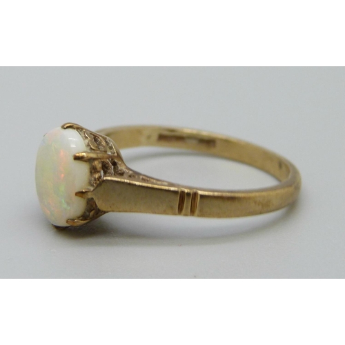 1098 - A 9ct gold ring set with an opal, 2g, L