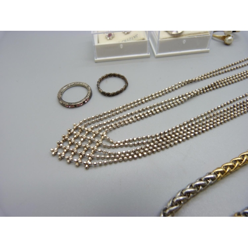 1101 - A silver multi-strand necklace, a Pierre Cardin necklace, three rings and two pairs of earrings