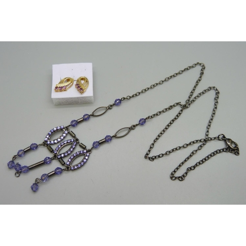 1124 - A pair of silver gilt earrings and a necklace