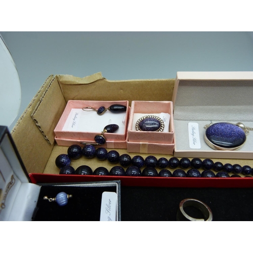 1135 - A collection of silver and silver mounted jewellery including some set with purple goldstone