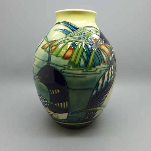 604 - A Moorcroft Torridon vase, 20.5cm, designed by Philip Gibson, boxed