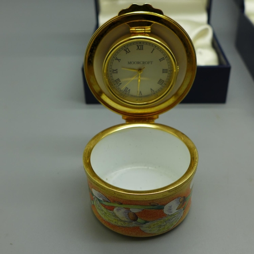 630 - A Moorcroft enamel circular box, circular box with clock and a Moorcroft clock dial and movement, bo... 