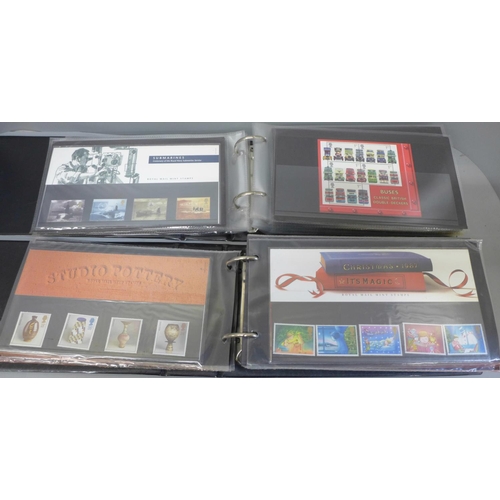 682 - Three albums of Royal Mail Mint Stamp sets, approximately 110 packs and booklets