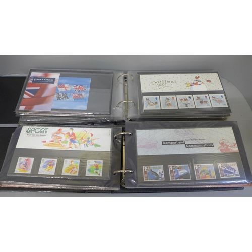 682 - Three albums of Royal Mail Mint Stamp sets, approximately 110 packs and booklets