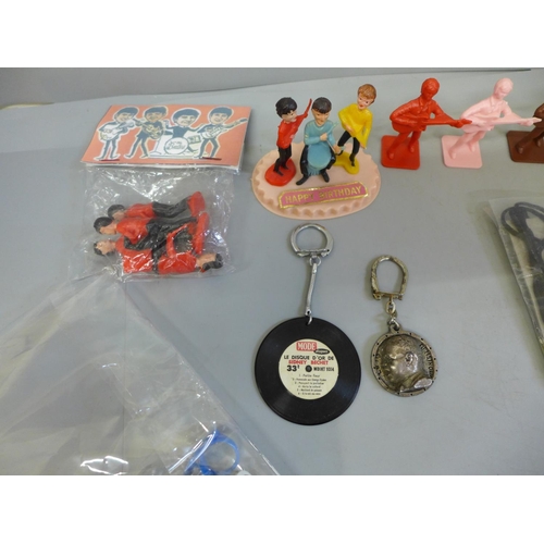 698 - The Beatles memorabilia figures, key rings, rings, etc.