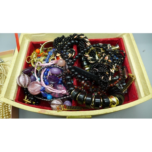 713 - Costume jewellery and wristwatches in a jewellery box