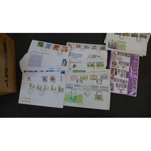 732 - Stamps; a box of GB first day covers and a catalogue