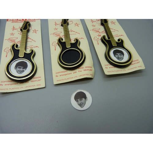 856 - The Beatles, five Invictus Beatles guitar jewellery brooches