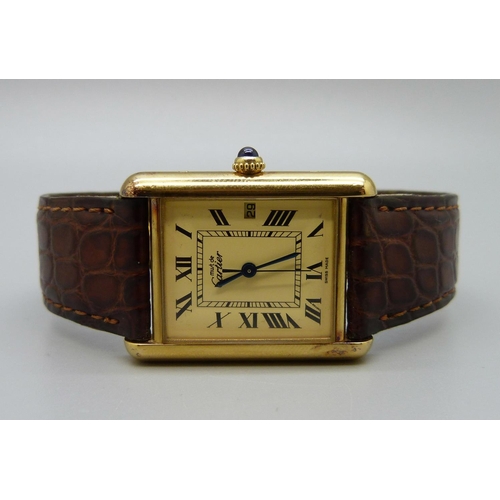 862 - A silver gilt cased must de Cartier tank wristwatch, in box with papers, 24mm case