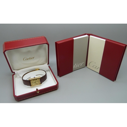 862 - A silver gilt cased must de Cartier tank wristwatch, in box with papers, 24mm case