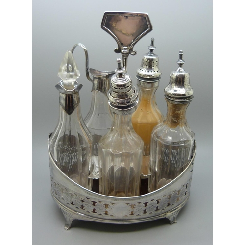 866 - A William IV silver navette shaped condiment stand with five bottles, London 1832, Charles Fox I, th... 