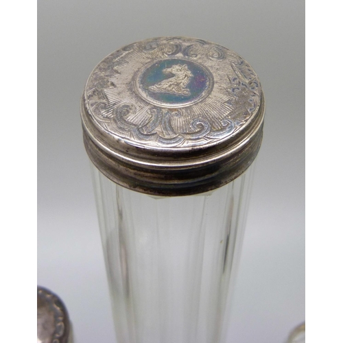 867 - A collection of seven silver topped bottles, scent and salts jar, including Victorian