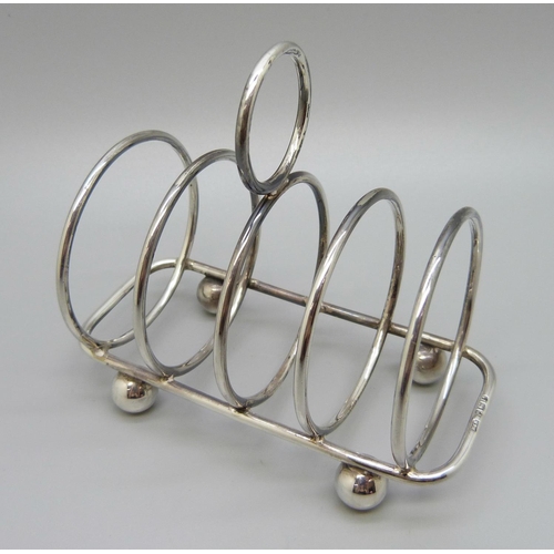 880 - A silver toast rack, Sheffield 1957, 76g