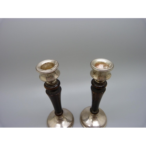 882 - A pair of silver and wood candlesticks, a/f, 12cm