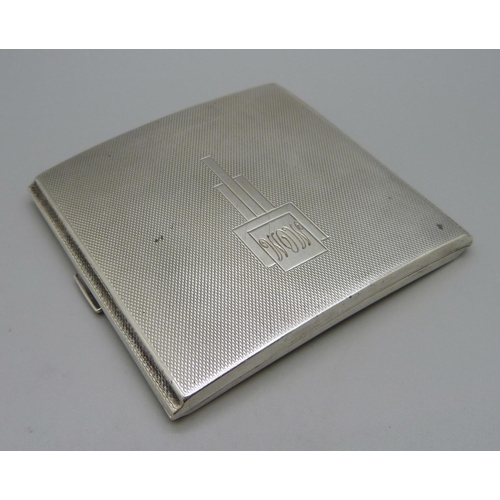 886 - A silver Art Deco cigarette case of curved form, Birmingham 1936, 128g