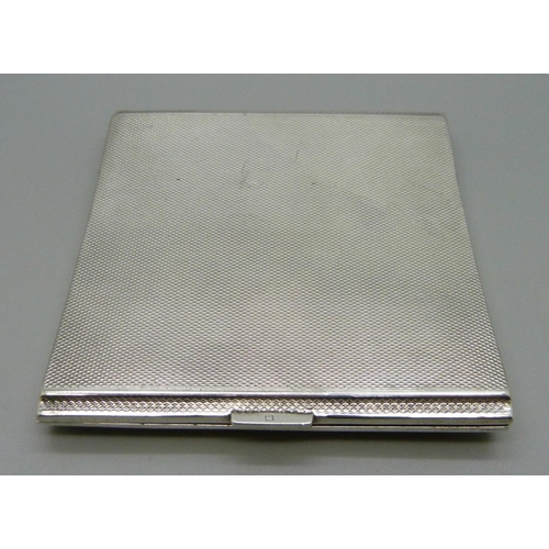 886 - A silver Art Deco cigarette case of curved form, Birmingham 1936, 128g