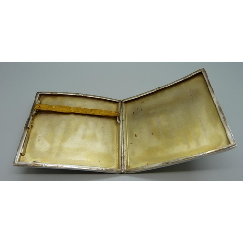 886 - A silver Art Deco cigarette case of curved form, Birmingham 1936, 128g