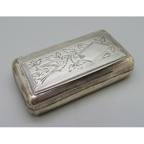 893 - A white metal snuff box, the top decorated with a bird, with diamond shaped control mark