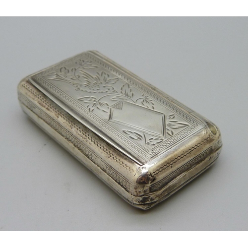 893 - A white metal snuff box, the top decorated with a bird, with diamond shaped control mark