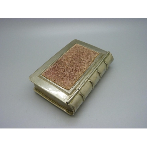 894 - A novelty box in the form of a book, 7.5cm x 11.5cm