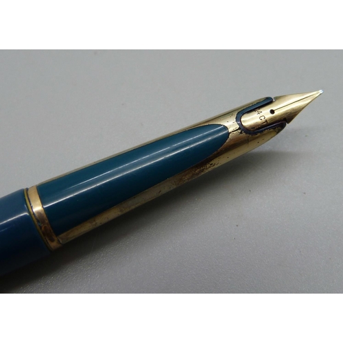 896 - A Watermans cartridge fountain pen with rolled gold lid and 14ct gold nib