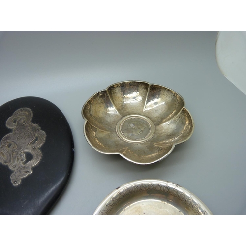 897 - Two white metal dishes inset with coins and two hand mirrors, one silver and tortoiseshell and one w... 