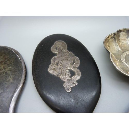 897 - Two white metal dishes inset with coins and two hand mirrors, one silver and tortoiseshell and one w... 