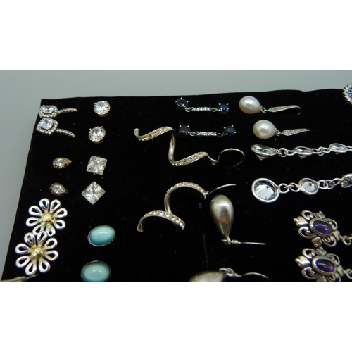 899 - Twenty-six pairs of silver earrings