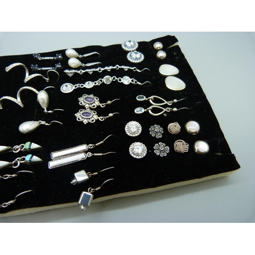 899 - Twenty-six pairs of silver earrings