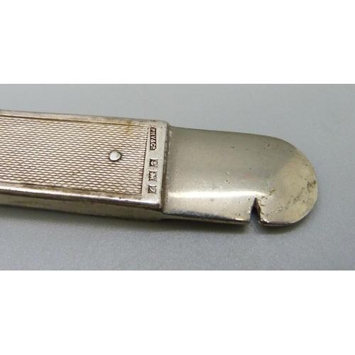 906 - A large hallmarked silver mounted cigar cutter, the blade marked Solingen