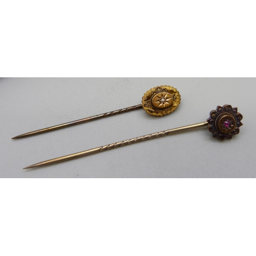 953 - Two late Victorian 15ct gold stick pins, one set with a diamond and one set with a ruby, 3.5g