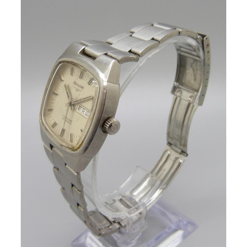 976 - A Longines Conquest automatic day-date wristwatch on a Longines bracelet strap