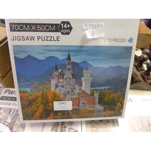 2042 - Three 1000 piece jigsaws, German stone castle,  Paris street scene and London impressionist sealed