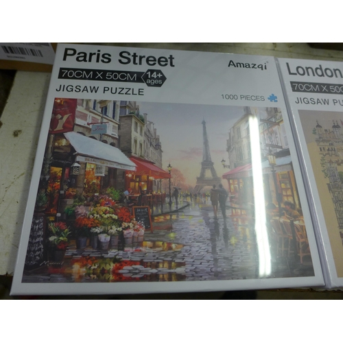 2042 - Three 1000 piece jigsaws, German stone castle,  Paris street scene and London impressionist sealed