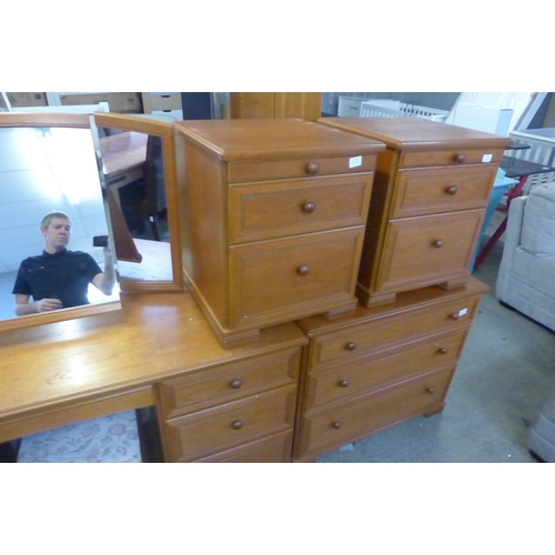 1640 - A Stag teak effect dressing table, stool, pair of bedside chests, three drawer chest and a five draw... 