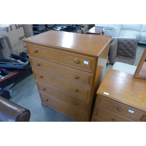 1640 - A Stag teak effect dressing table, stool, pair of bedside chests, three drawer chest and a five draw... 