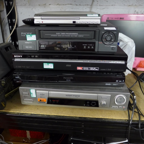 2255 - Three DVD players and 2 VHS VCR/video cassette players