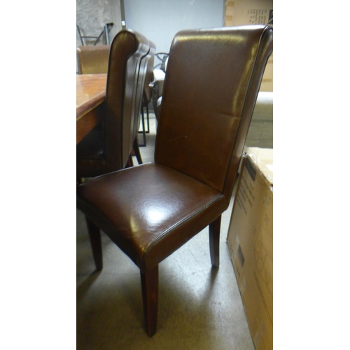 1641 - A large Indian hardwood dining table and eight brown leather and black piping dining chairs