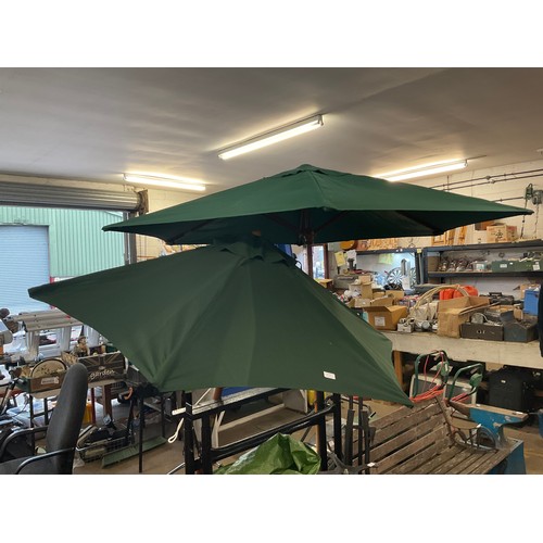 2297 - Two approx. 1.5m diameter teak and green fabric folding parasols