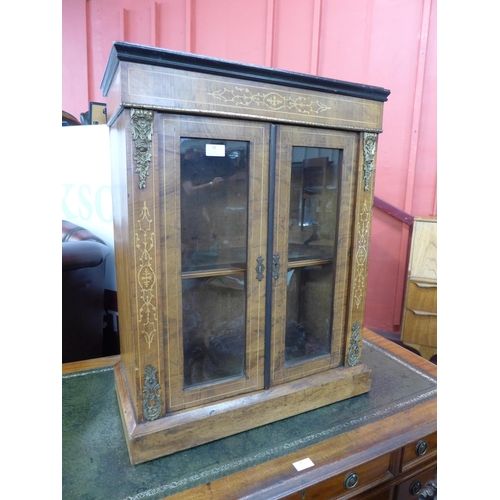 599 - A small Victorian inlaid walnut and ormolu mounted pier cabinet