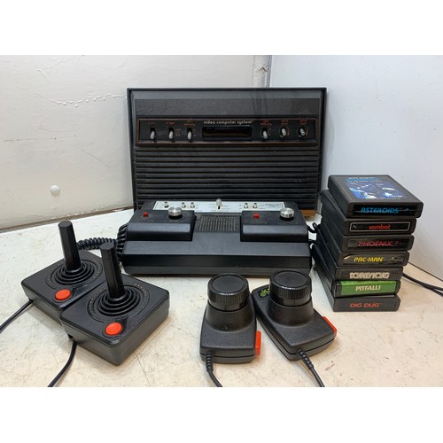 2226 - Atari 2600 Woody vintage gaming console with 7 games and vintage Grand Stand game - both W with joys... 