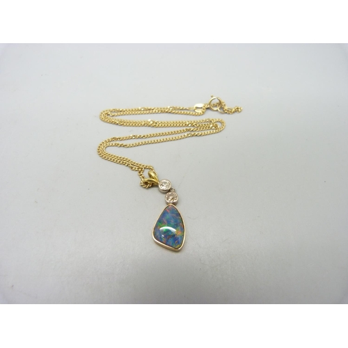 1014 - An opal and diamond set pendant on a 9ct gold chain, chain 3.6g