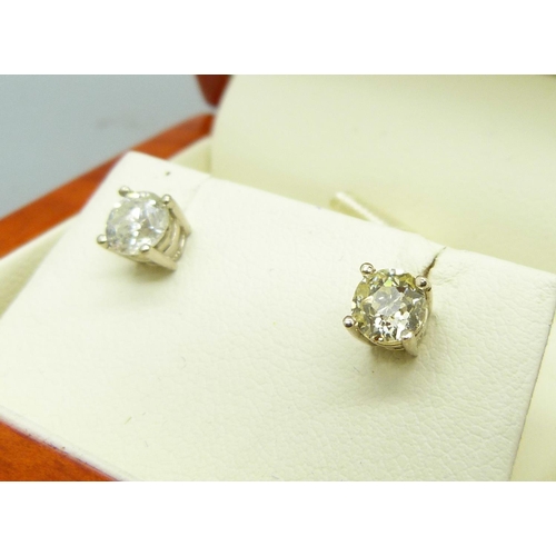 1018 - A pair of 18ct gold and diamond earrings, approximately 1ct total diamond weight