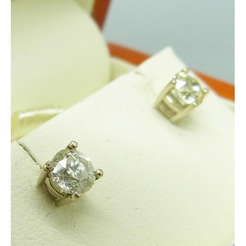 1018 - A pair of 18ct gold and diamond earrings, approximately 1ct total diamond weight