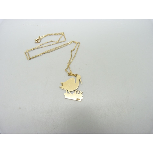 1022A - A 9ct gold 'stork' pendant on a 9ct gold chain, total weight 3.7g