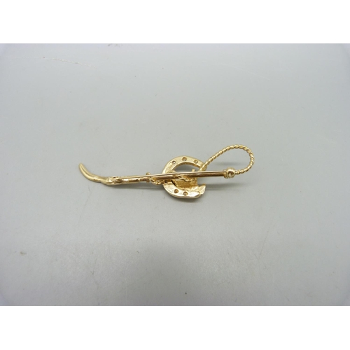 1029 - A 9ct gold horse racing brooch, 10.8g, 72mm